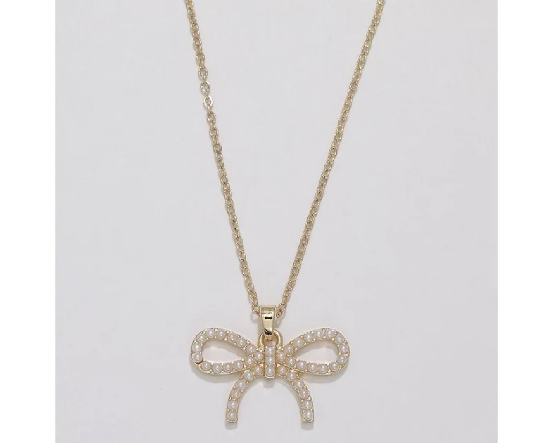 Modern women's necklaces-Periwinkle by Barlow : Delightful gold bow with pearls - Necklace